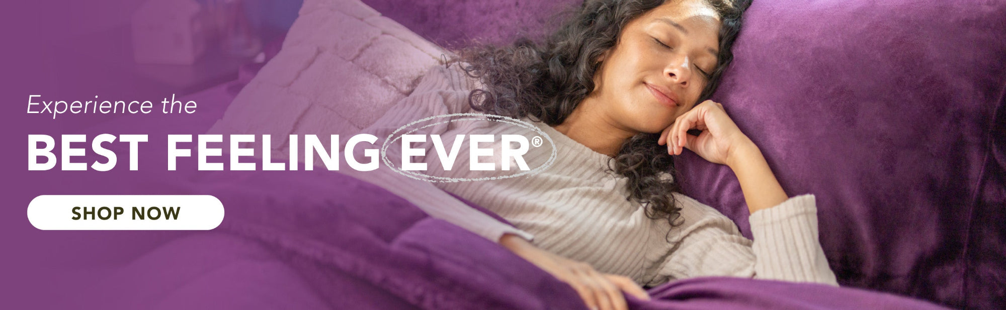 Woman lying on a purple bedding with text 'Experience the BEST FEELING EVER' and 'SHOP NOW' button.
