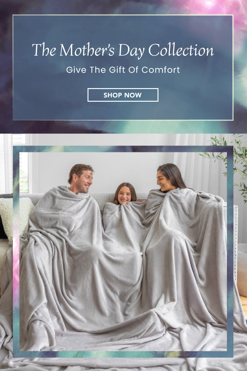 The Mother's Day Collection. Give the Gift of Comfort. Shop Now. Image of a family of 3 sharing a grey blanket.