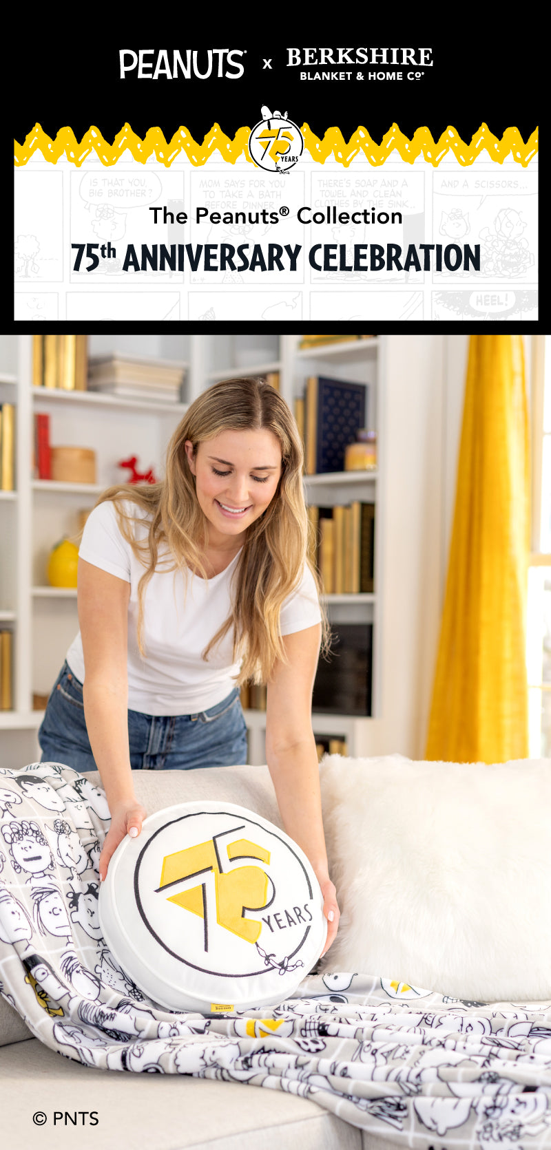 The Peanuts® Collection. 75th Anniversary Celebration. Image of a girl with a throw and pillow set, in a room that is black, white, and gold themed. 