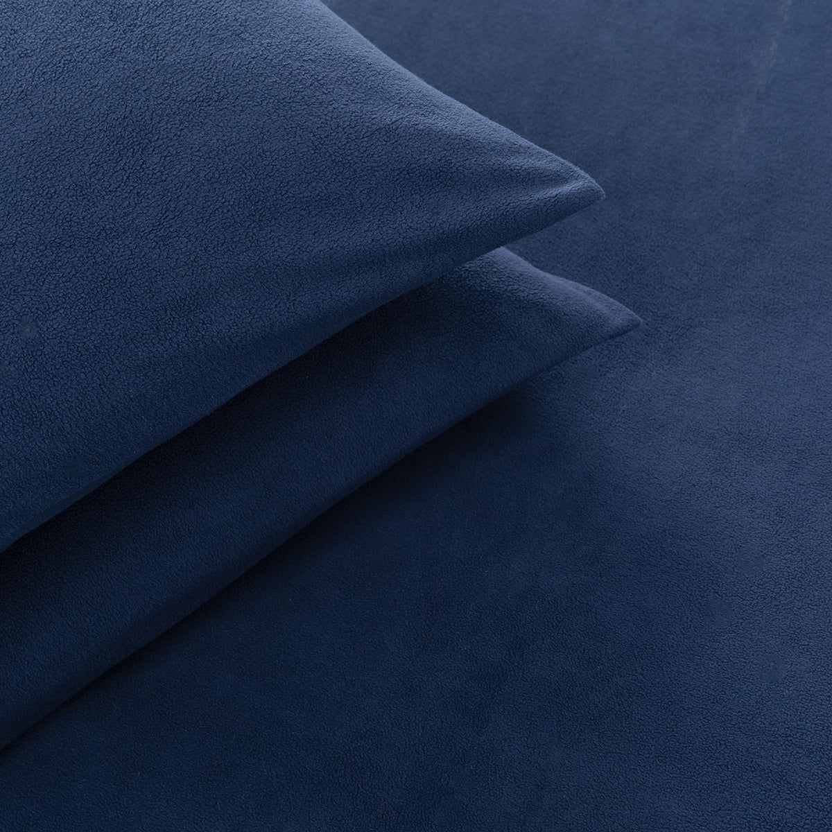 Close-up of All-Season Microfleece Sheet Set pillowcases in Navy