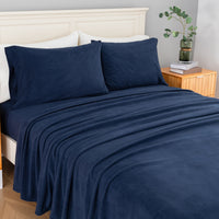 All-Season Microfleece Sheet Set in Navy on a made bed, angled view
