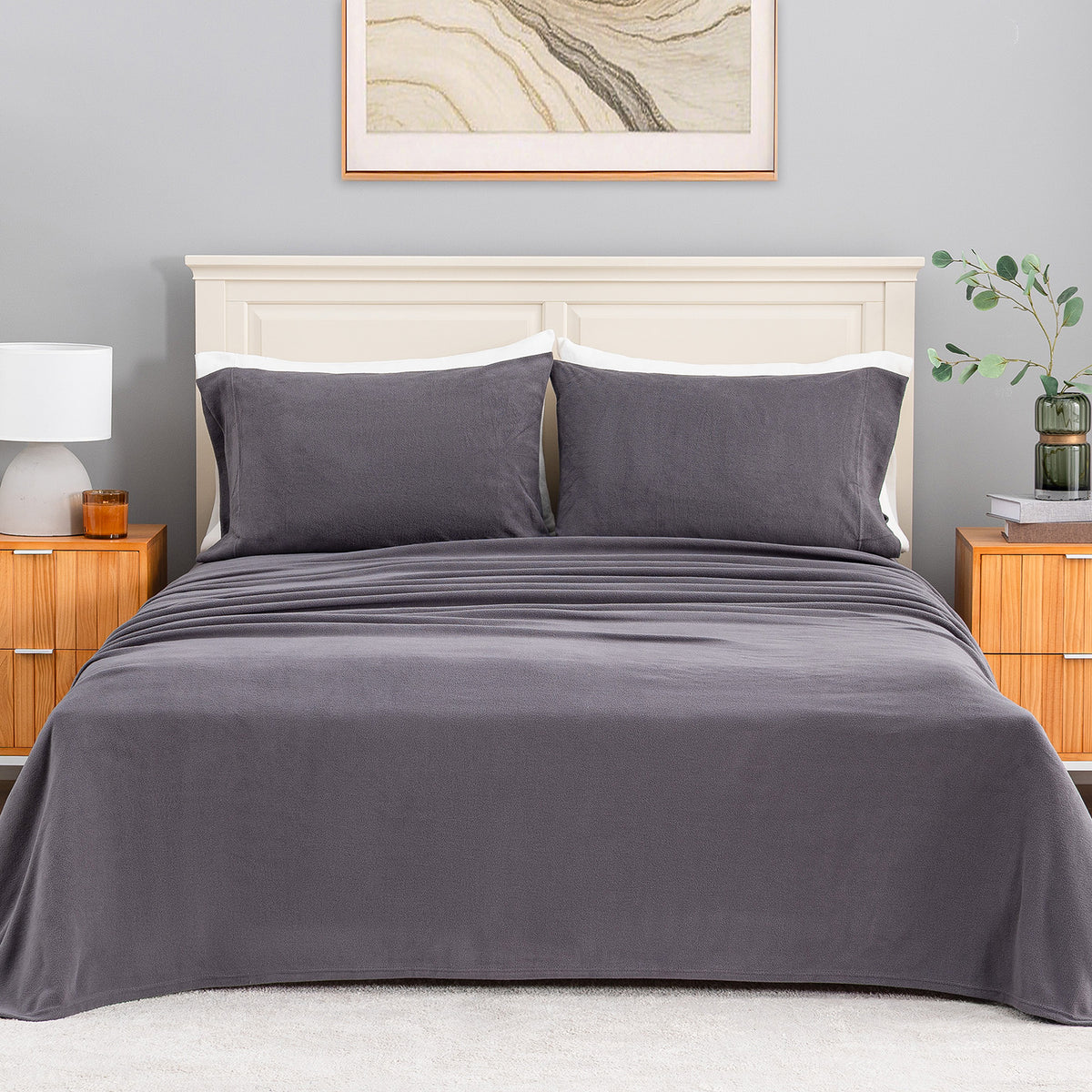 All-Season Microfleece Sheet Set in Space Grey on a made bed with a cream headboard, front view