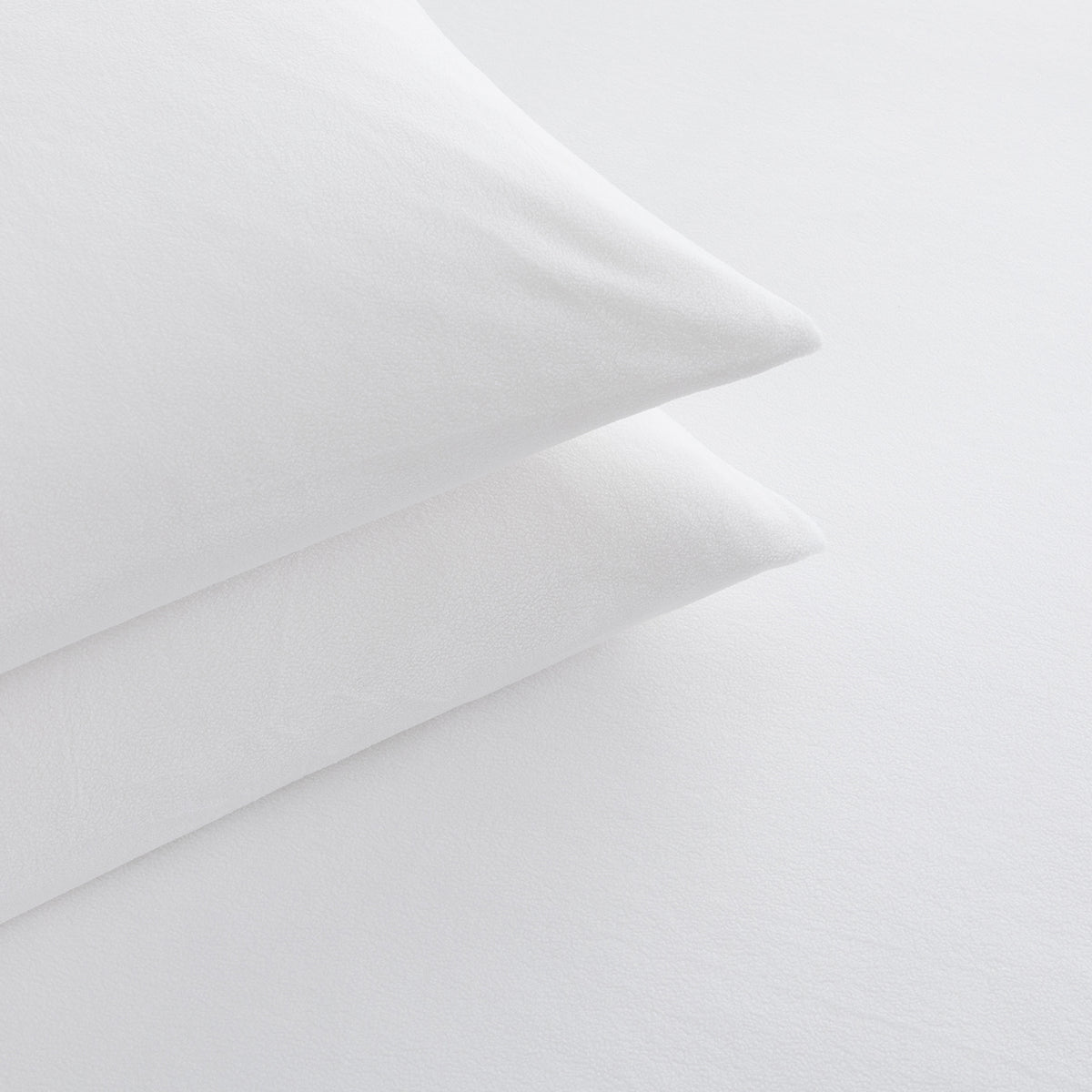 Close-up of All-Season Microfleece Sheet Set pillowcases in True White