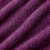 A close-up of plush, shaggy faux fur fabric in a rich purple color, showing the soft texture and folds.