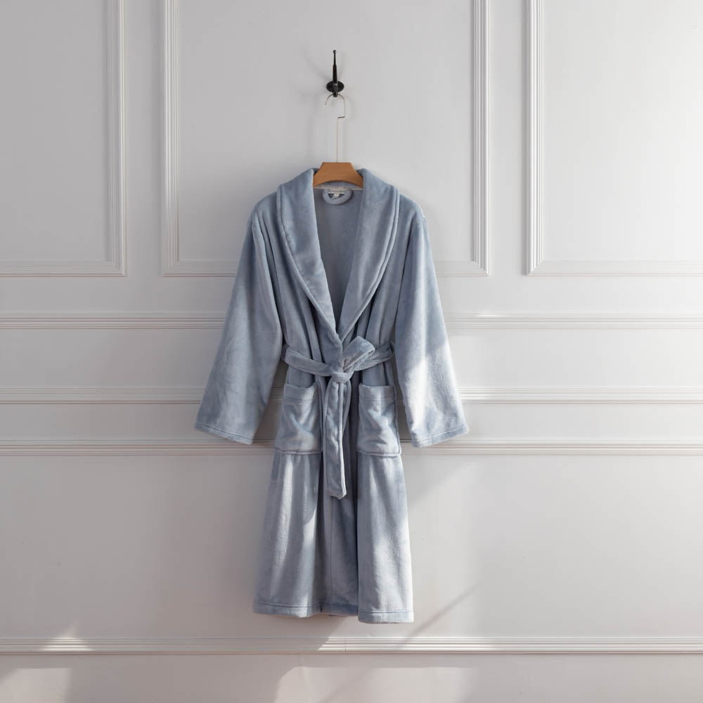 A light blue VelvetLoft Robe displayed on a hanger, styled with a belt tied neatly at the waist.