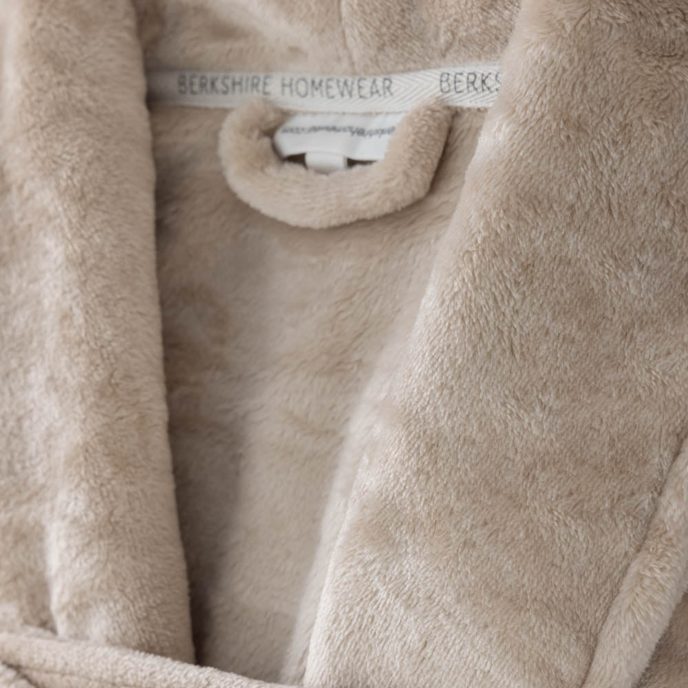 A close-up of the soft texture of a taupe VelvetLoft Robe, showcasing its plush fabric.