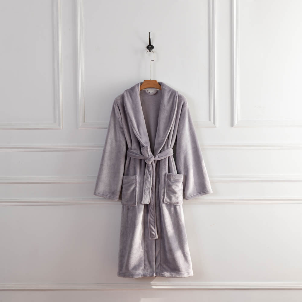 A lilac colored VelvetLoft Robe displayed on a hanger against a white wall.