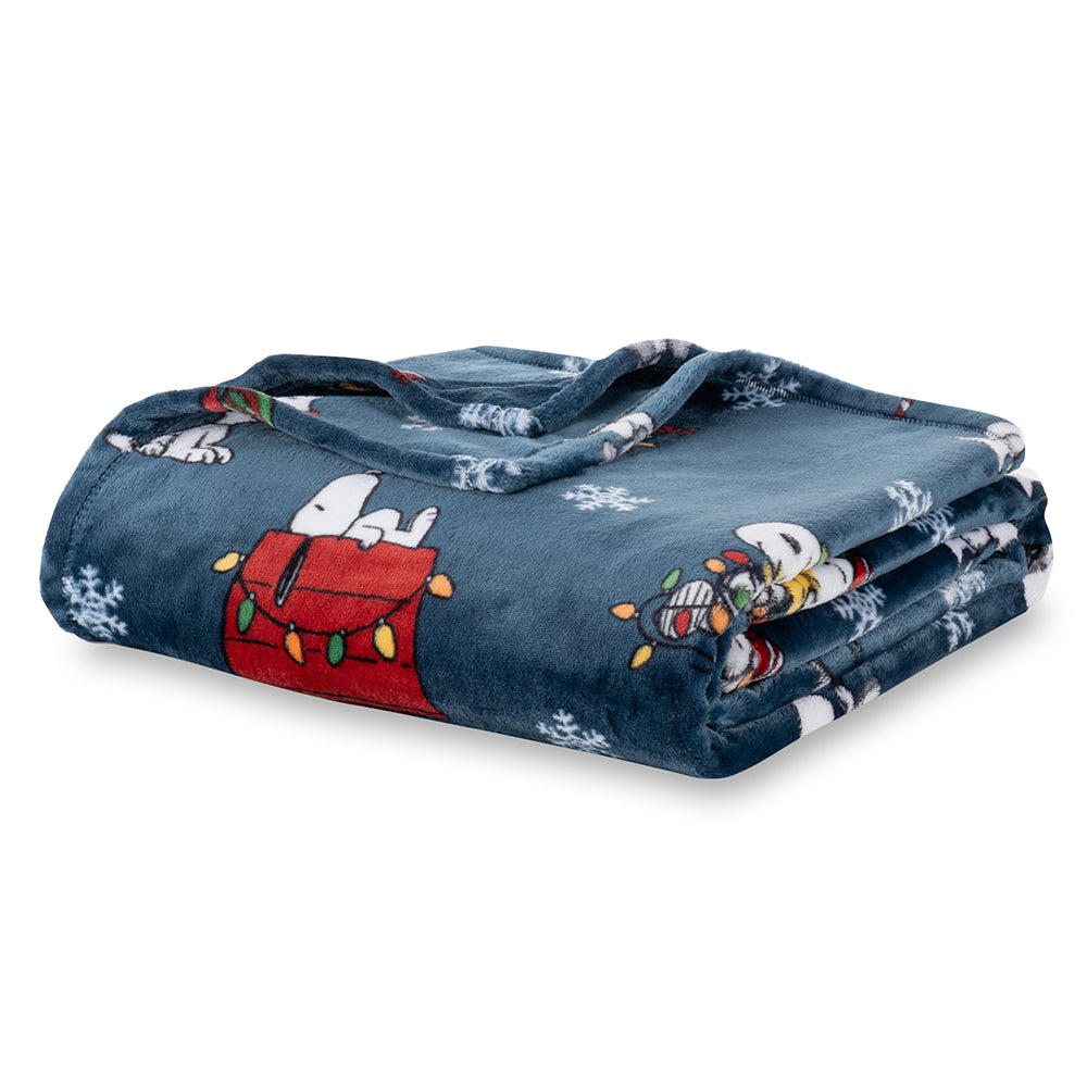 Folded denim blanket with cartoon characters on a white background