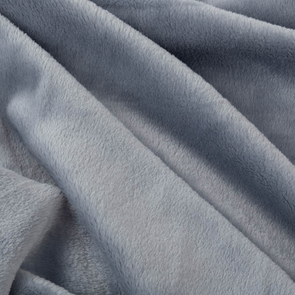 Close up of a blue velvety plush family blanket displaying its silky smooth texture.
