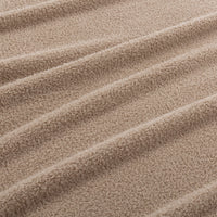 Close-up of beige fabric with wavy texture