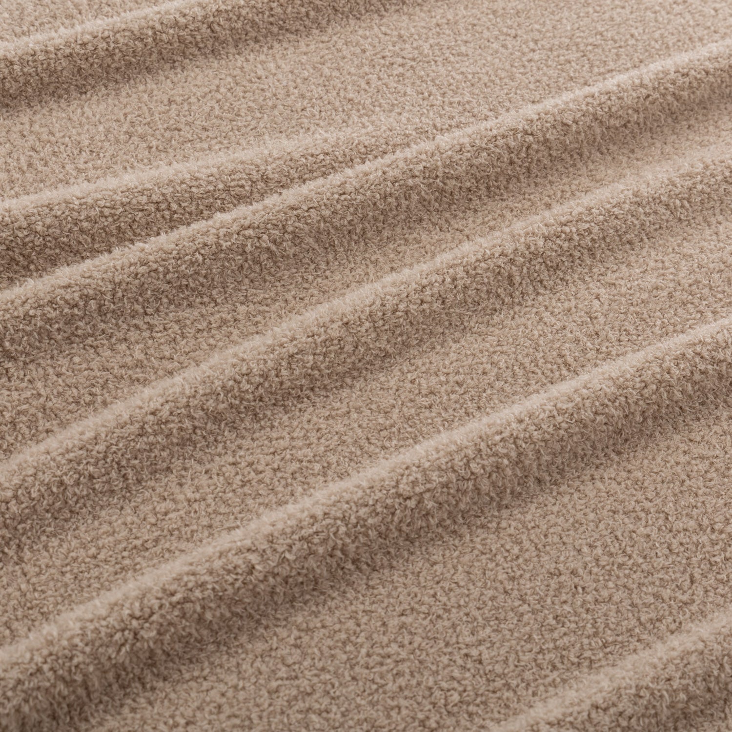 Close-up of beige fabric with wavy texture