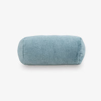 Blue cylindrical pillow on a white background