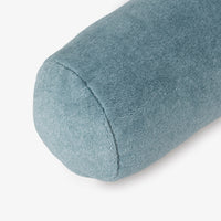 Blue cylindrical pillow on a white background