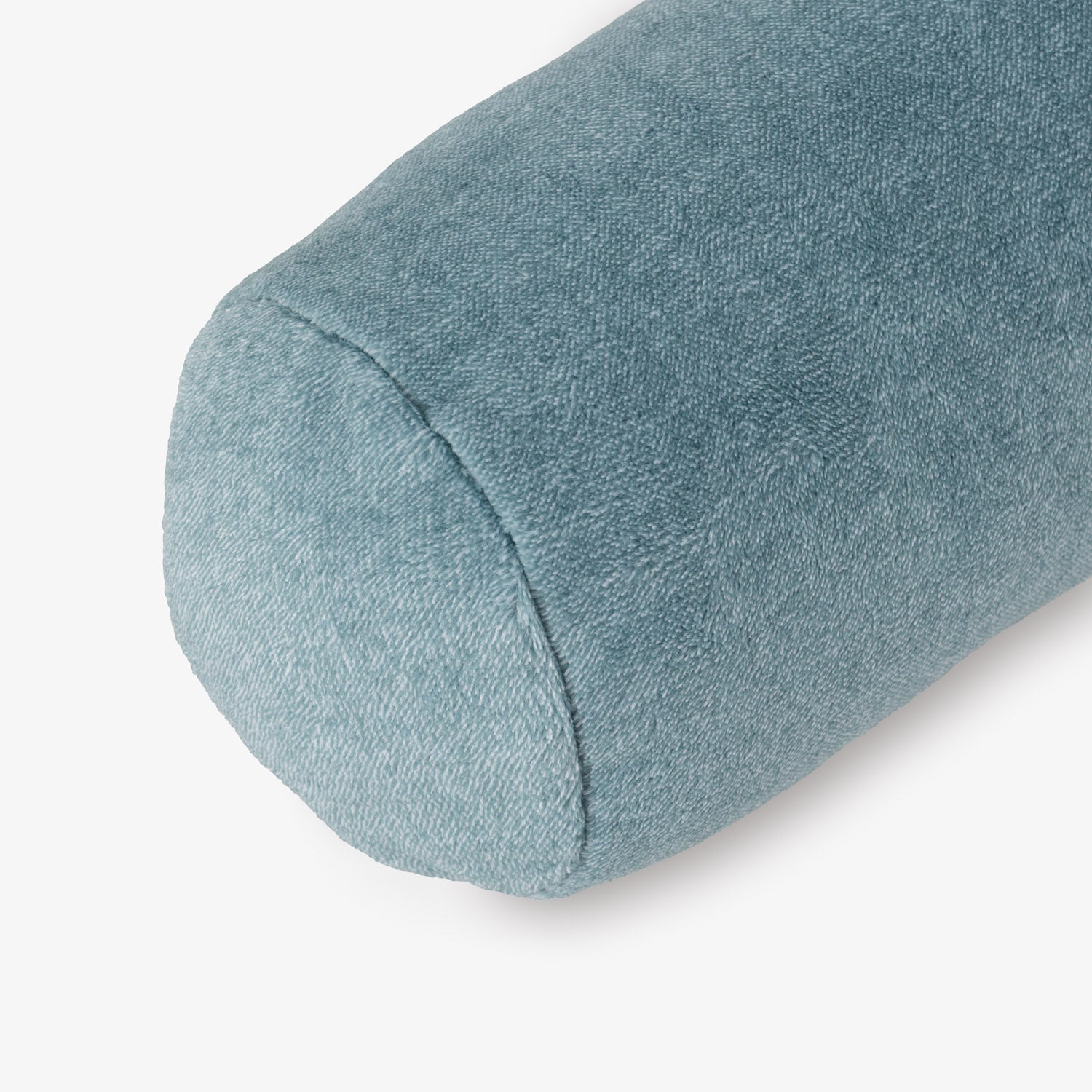 Blue cylindrical pillow on a white background
