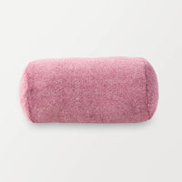 A pink neckroll pillow on a white background.