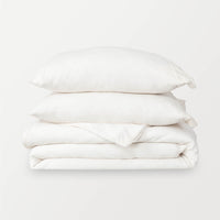 VelvetLoft® Plush Duvet Cover Set in Cream, neatly folded with two matching pillow shams stacked on top.