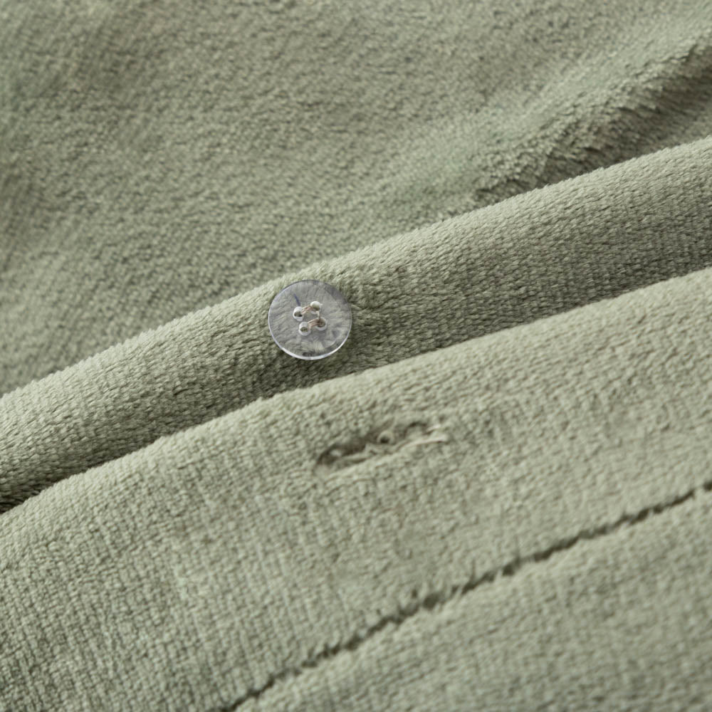 Close-up of the Dark Sage Green VelvetLoft® fabric and button closure of the duvet set, highlighting its plush, silky texture.