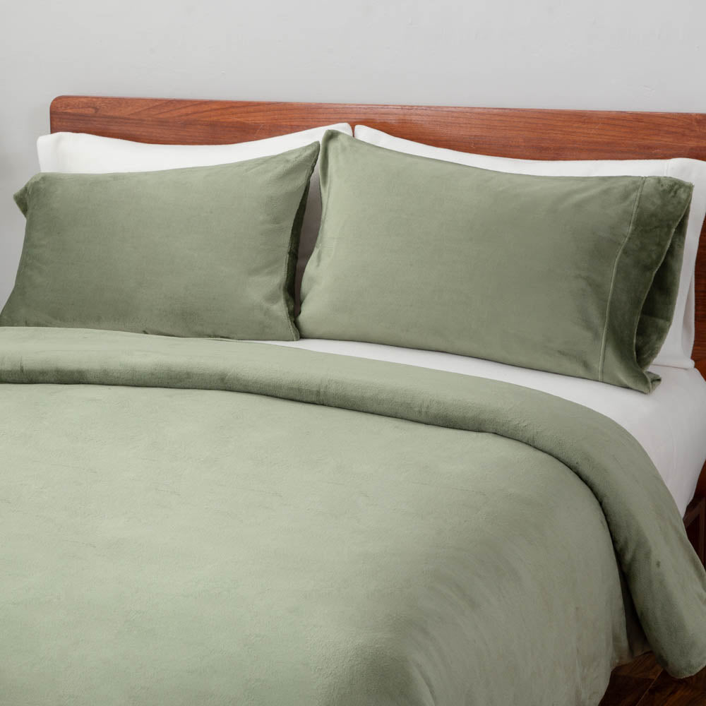 VelvetLoft® Duvet Set in Dark Sage on a bed, close view of the duvet cover and pillow shams