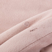Close-up of the Rose Smoke VelvetLoft® fabric and button closure of the duvet set, highlighting its plush, silky texture.