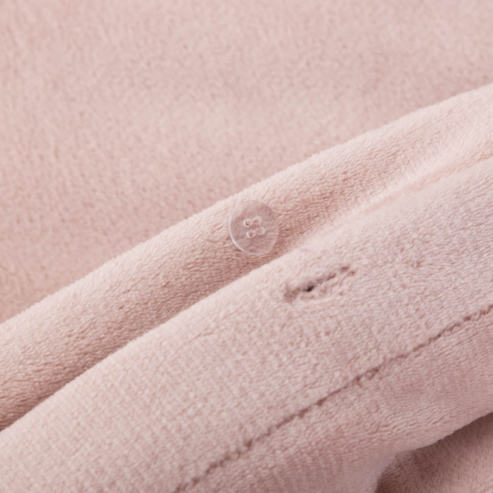Close-up of the Rose Smoke VelvetLoft® fabric and button closure of the duvet set, highlighting its plush, silky texture.