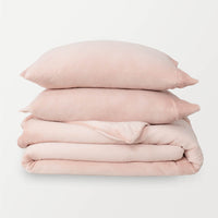 VelvetLoft® Plush Duvet Cover Set in Rose Smoke, neatly folded with two matching pillow shams stacked on top.