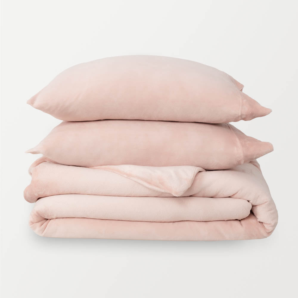 VelvetLoft® Plush Duvet Cover Set in Rose Smoke, neatly folded with two matching pillow shams stacked on top.