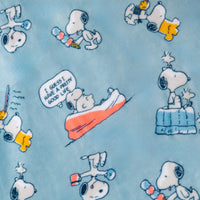 Close up of a blue Peanuts 75th Anniversary Throw.