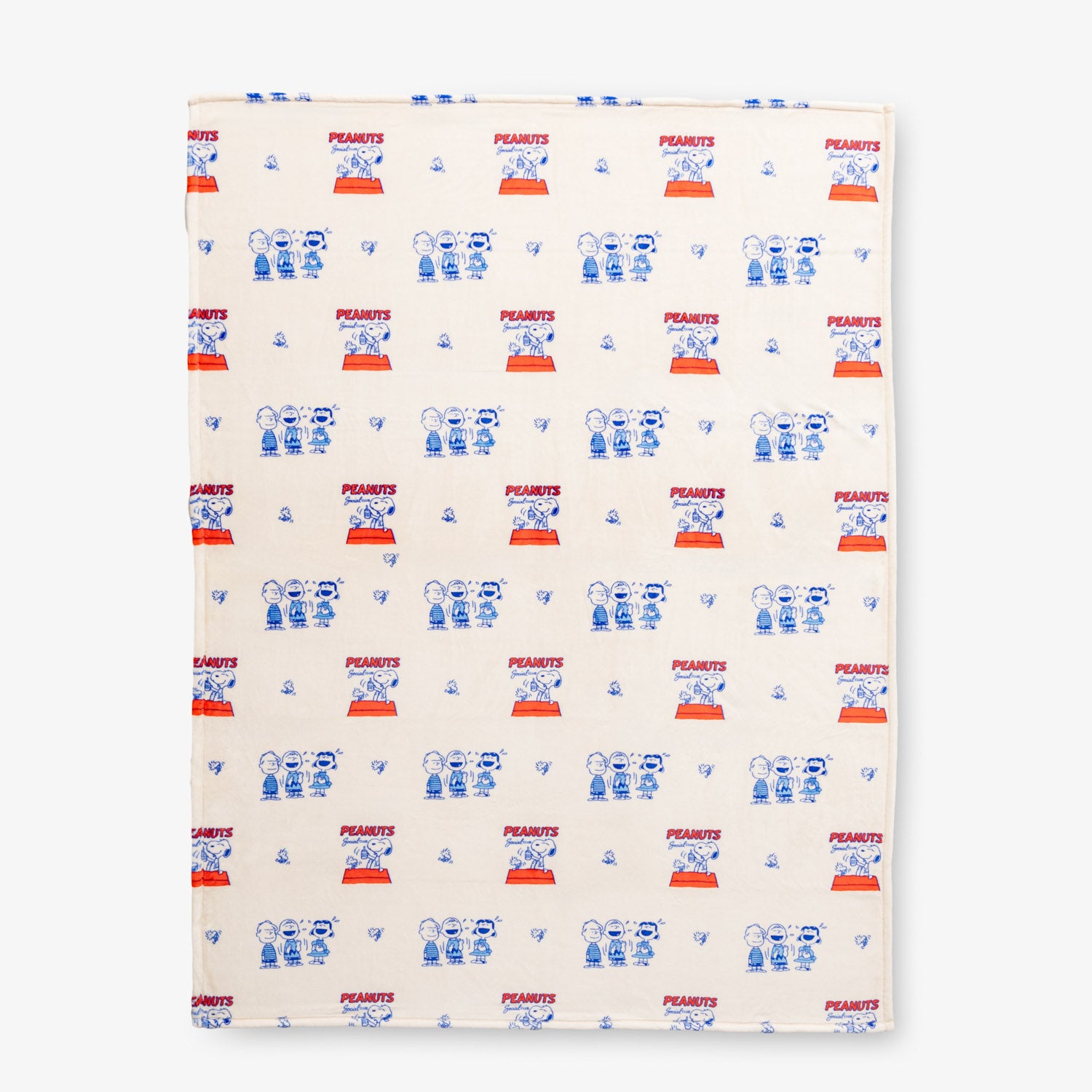 Printed Peanuts 75th Anniversary Throw laid flat on a white surface.