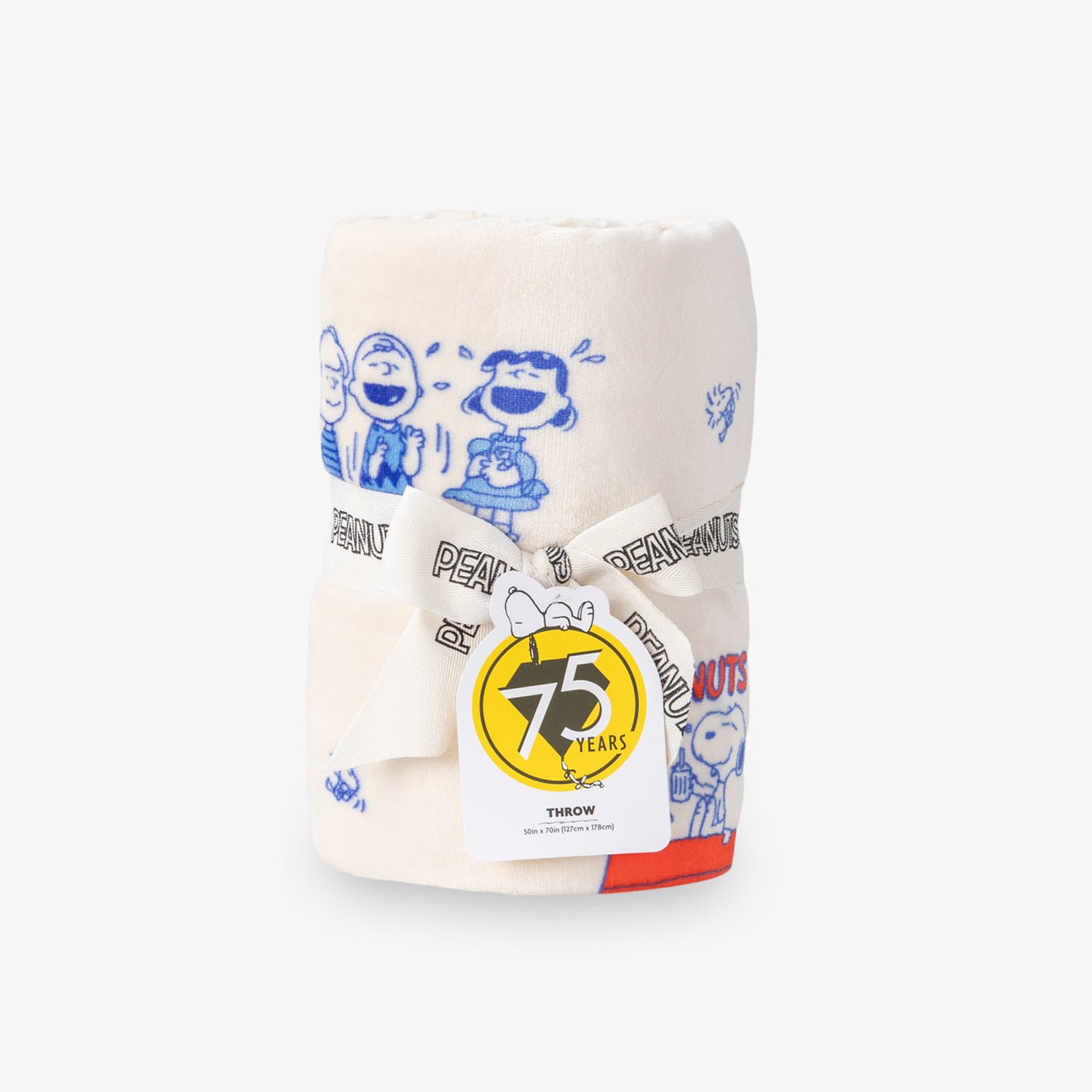Printed Peanuts 75th Anniversary Throw rolled neatly on a white surface.