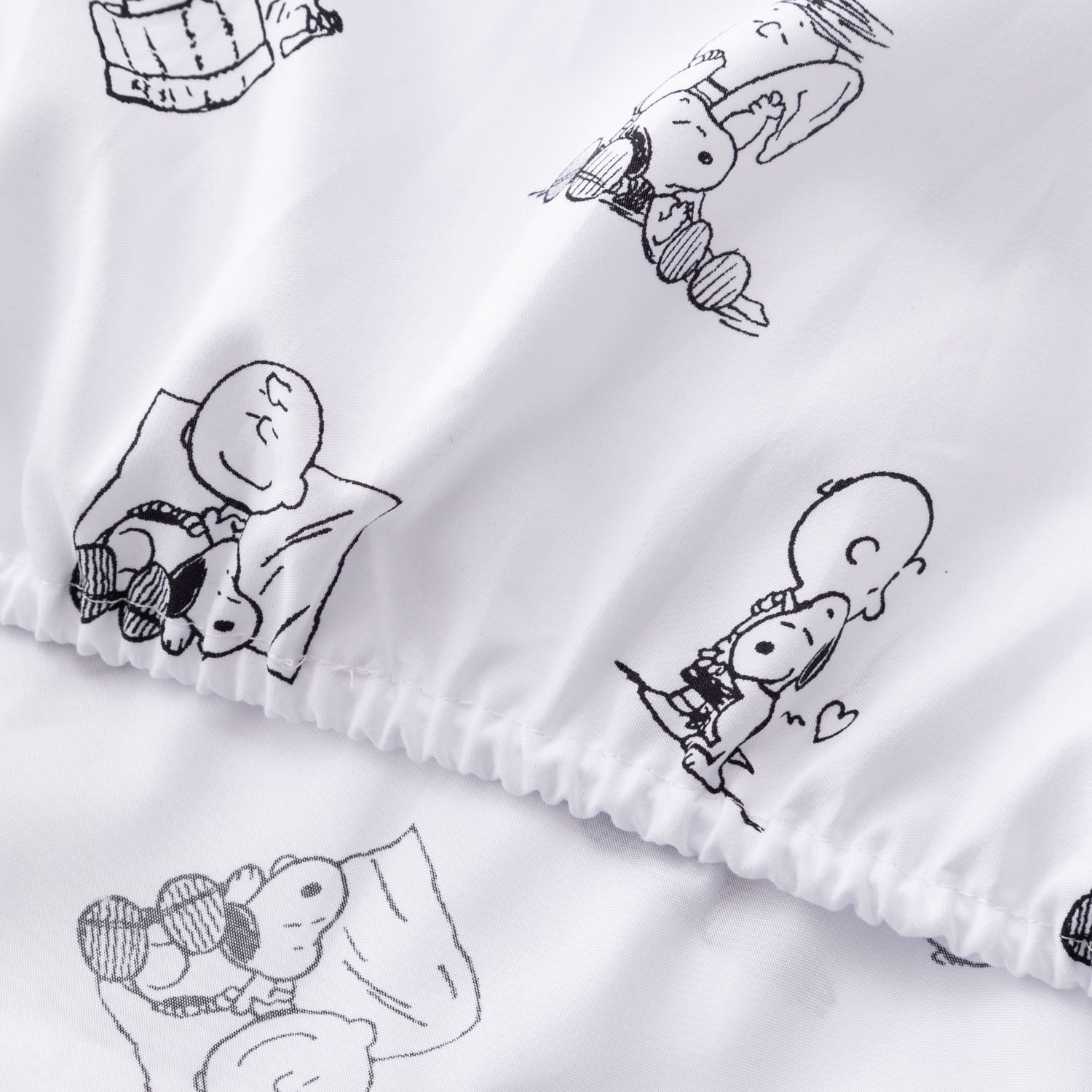 Close up of a Peanuts printed microfiber sheet set.