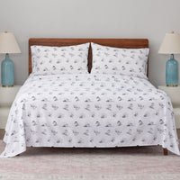 Peanuts printed microfiber sheet set dressed on a bed.