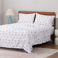 Peanuts printed microfiber sheet set dressed on a bed.