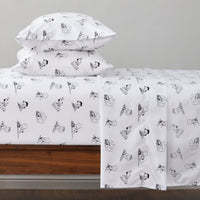 Peanuts printed microfiber sheet set dressed on a bed.