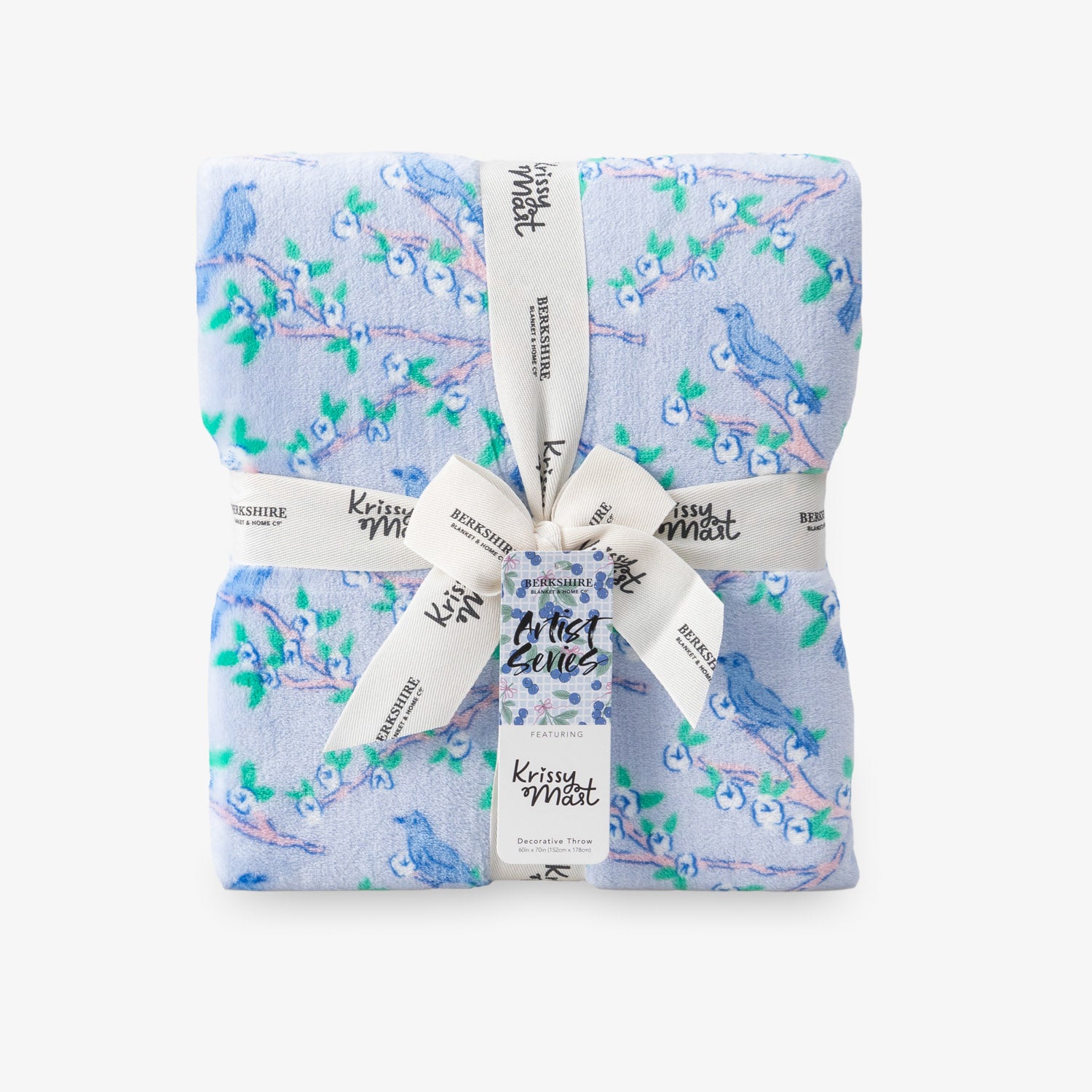 Krissy Mast Artist Series printed cherry blossom print throw folded neatly on a white surface.