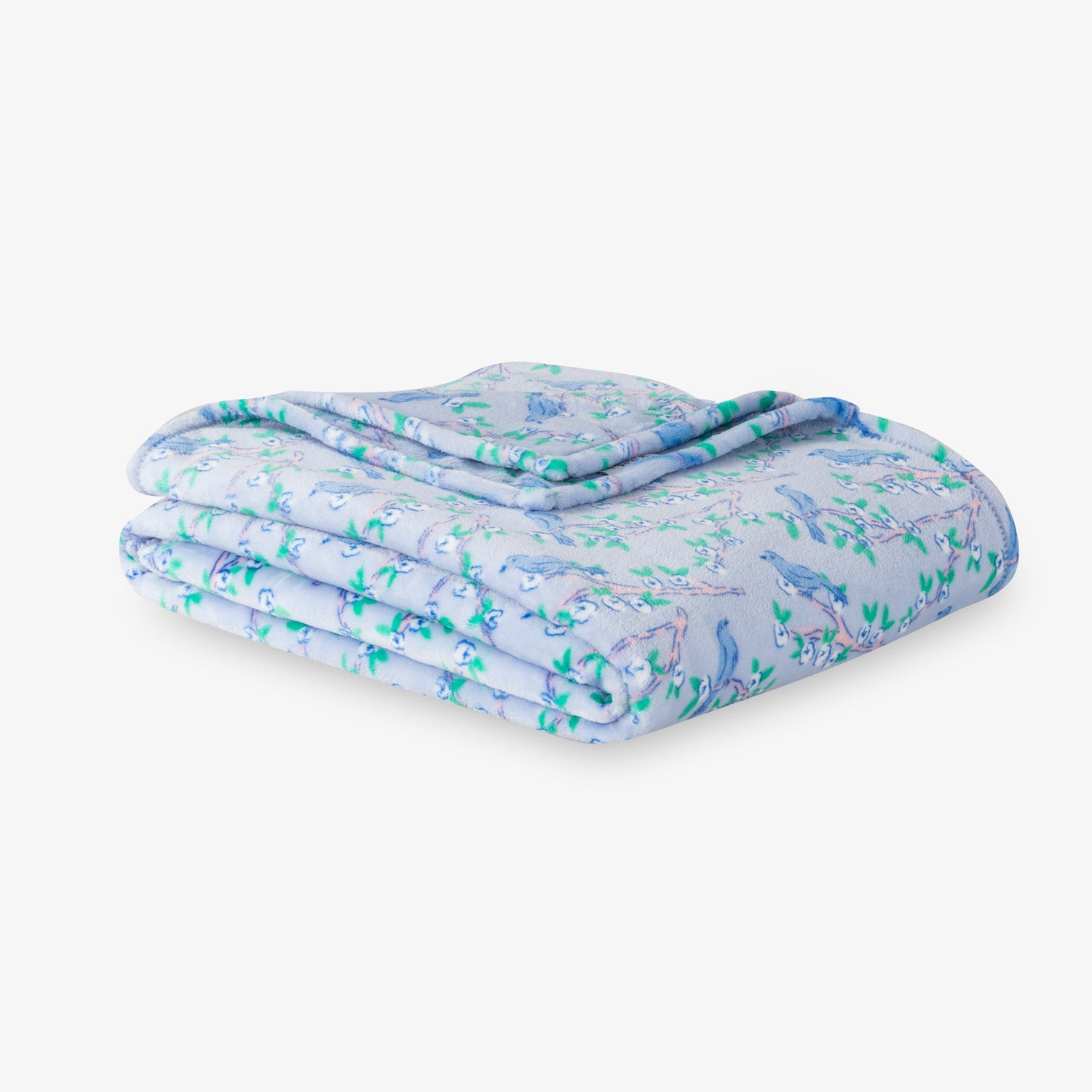 Krissy Mast Artist Series printed cherry blossom print throw folded neatly on a white surface.