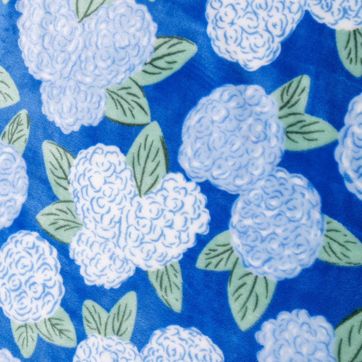 Close up of a Krissy Mast Artist Series printed hydrangea print throw.