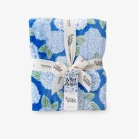 Krissy Mast Artist Series printed hydrangea print throw folded neatly on a white surface.