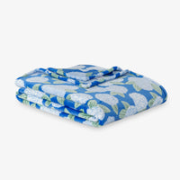 Krissy Mast Artist Series printed hydrangea print throw folded neatly on a white surface.