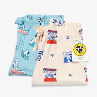 Peanuts 75th Anniversary printed lounge pants folded neatly on a white surface.