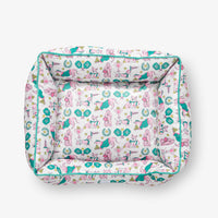 Pickleball pups pet bed set on a white surface.