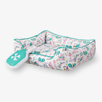 Pickleball pups dog toy and pet bed set on a white surface.