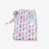 Krissy Mast printed lounge pants folded neatly on a white surface.