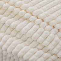A close up of a cream VelvetLoft waffle blanket.