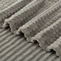 A close up of a sage green VelvetLoft waffle blanket.