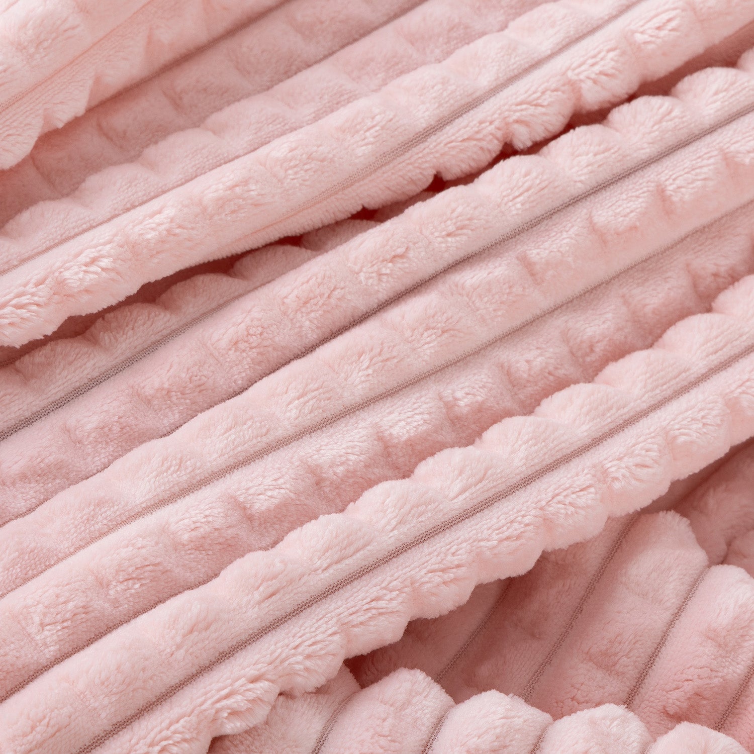 A close up of a pink waffle blanket.
