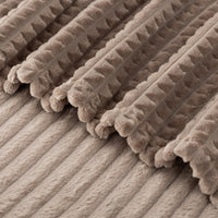 A close up of a brownVelvetLoft waffle blanket.
