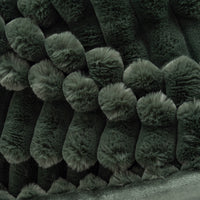 Close-up of dark green textured fabric with a pattern