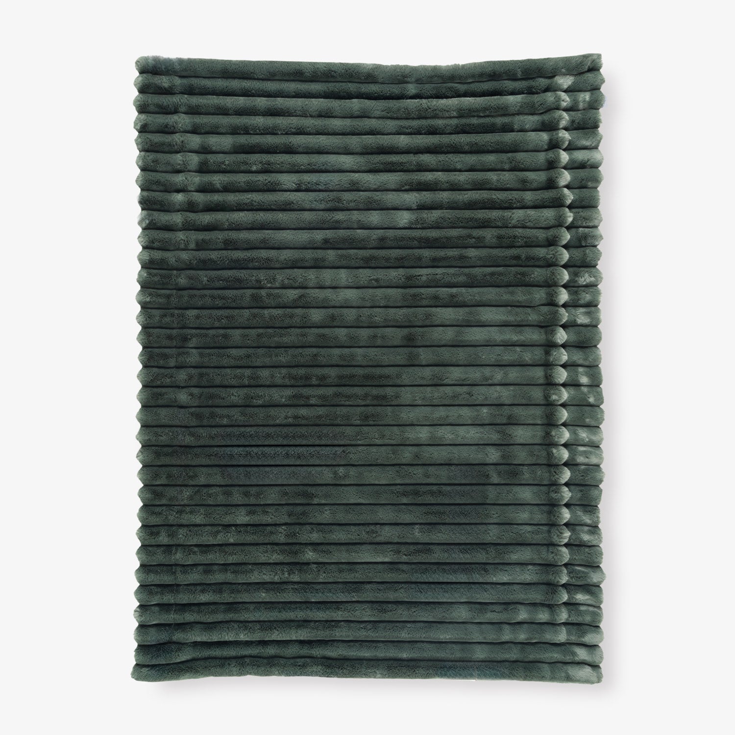 Folded dark green textured blanket on a white background