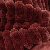 Close-up of a textured red throw blanket 