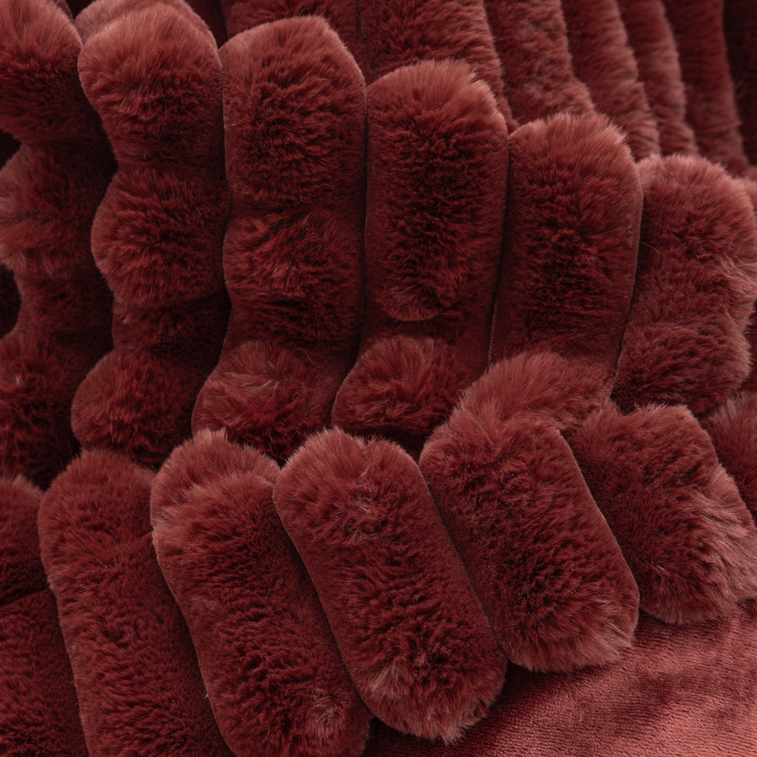 Close-up of a textured red throw blanket 